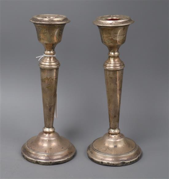 A pair of 1970s silver candlesticks, (a.f.), 21cm.